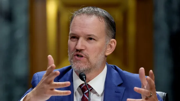 U.S. Trade Representative Jamieson Greer raises his hands while speaking during a Senate Finance Committee hearing on July 22, 2026 in Washington, D.C.