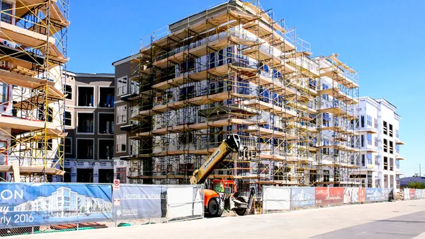 Scaffolding around apartment construction site