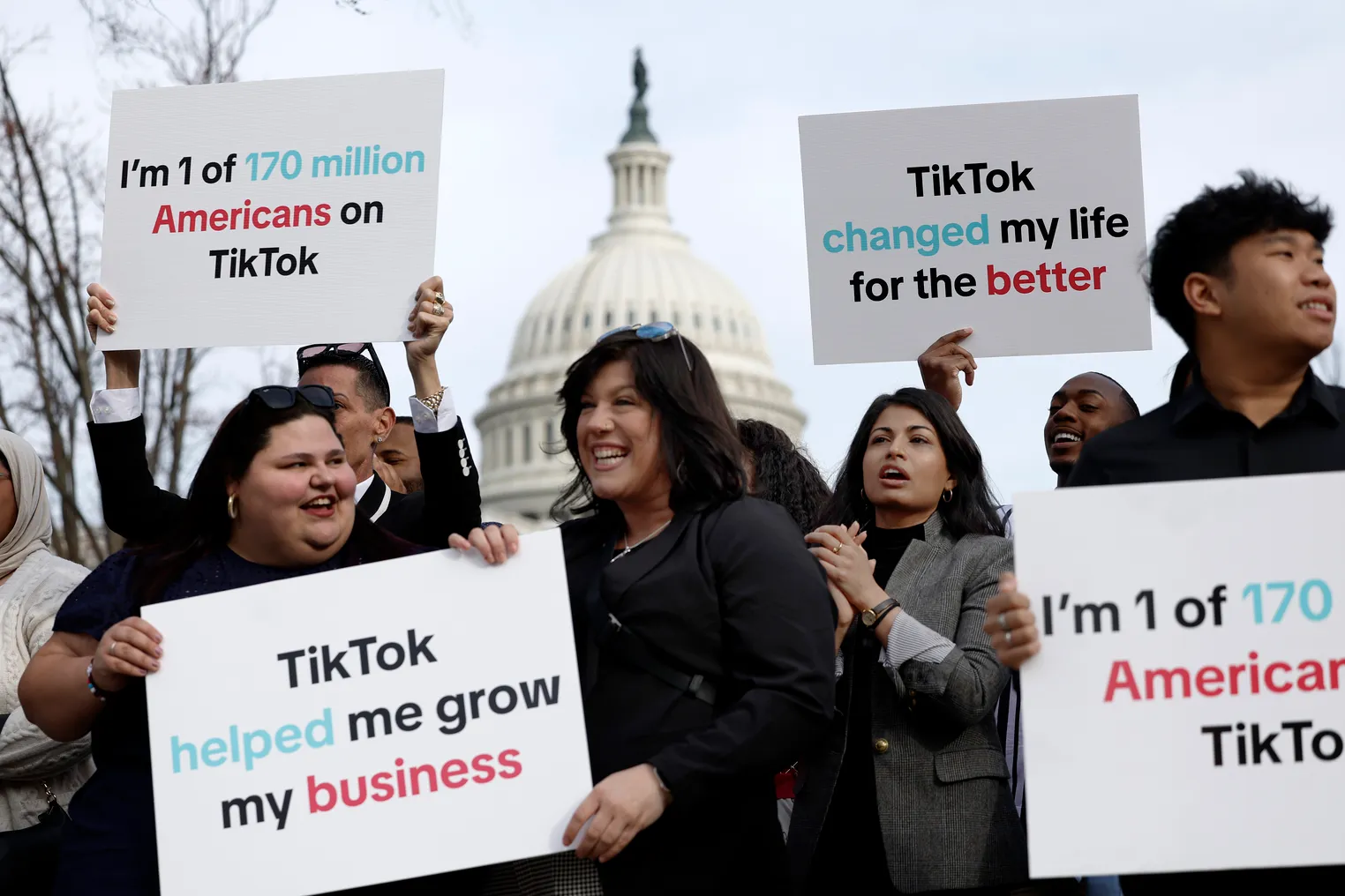 Individuals hold signs in support of TikTok outside the U.S. Capitol Building on March 13, 2024 in Washington, DC.