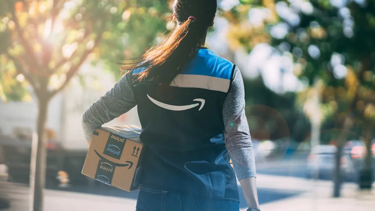 A woman delivering an Amazon package