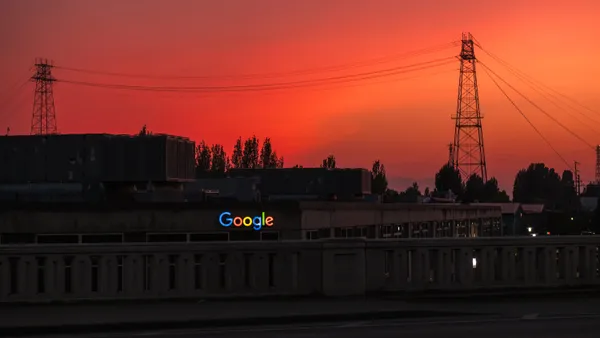 A google sign is illuminated at sunset over the Fremont neighborhood on South Lake Union in Seattle, Washington on July 4, 2023.