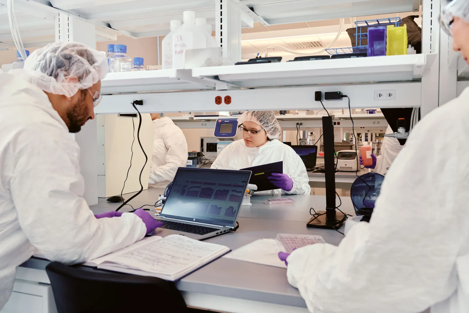 Researchers work in Outer Bio's labs.