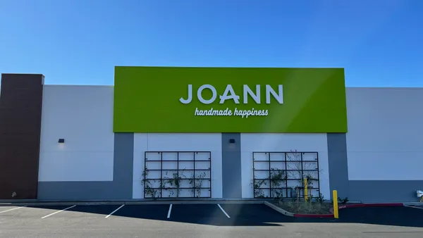 A bright green facade says "Joann" in white capital letters, and "handmade happiness" in white script.