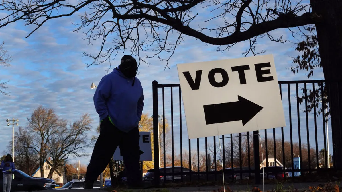 A sign directs voters at a polling place on November 08, 2022 in Milwaukee, Wisconsin.