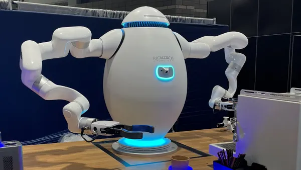 Adam, a robot made by Richtech Robotics, makes an espresso drink at the National Restaurant Association Show in May 2025.