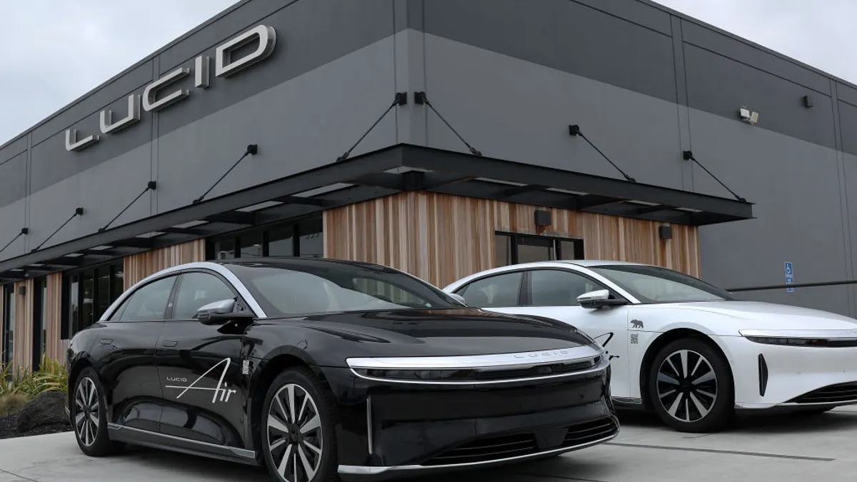Brand new Lucid electric cars sit parked in front of a Lucid Studio showroom on May 24, 2024, in San Francisco, California.