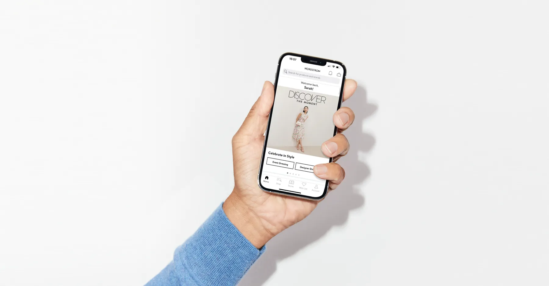 Person holds a phone with Nordstrom Marketplace on the screen.