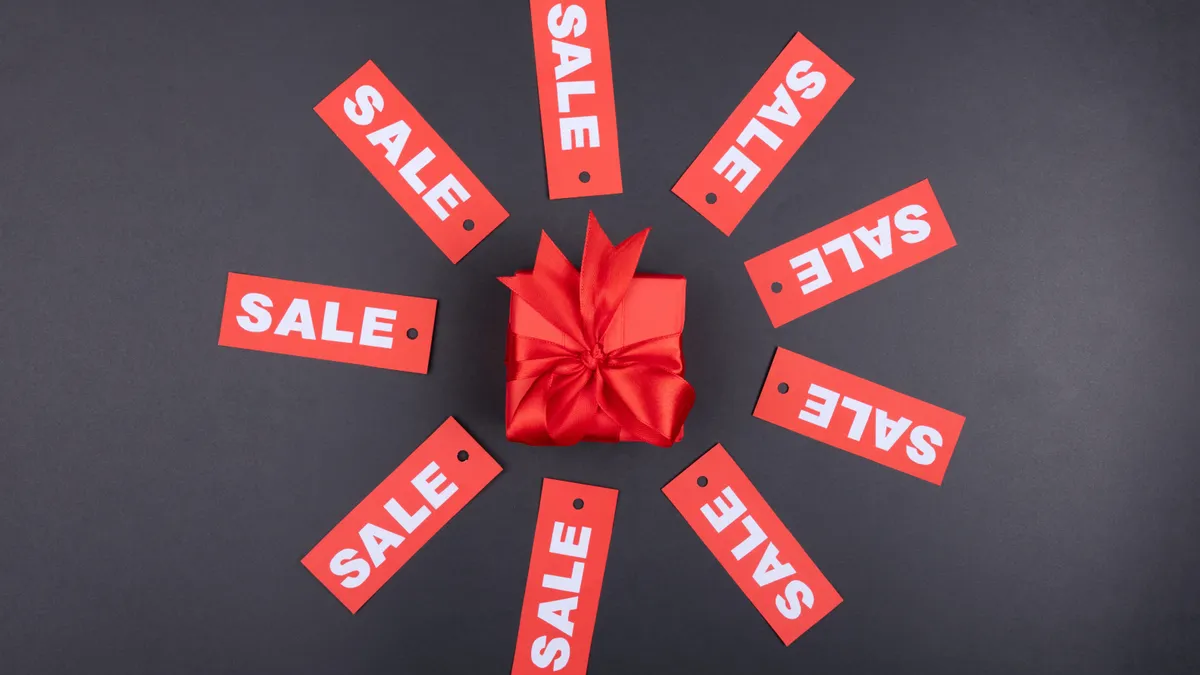 present surrounded by sale tags