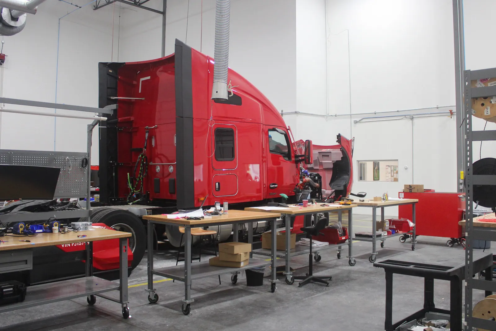 A Kodiak truck with an opened hood inside a terminal located in a Dallas area warehouse and office complex.