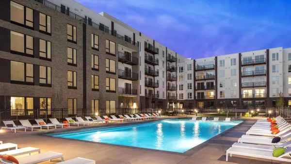 Mid-rise apartment surrounding a pool