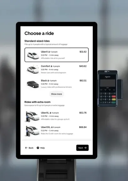 A standalone kiosk showing the Uber ride-hail app screen.