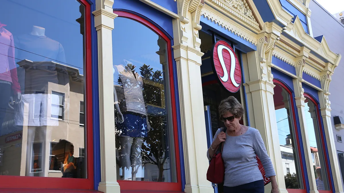 A pedestrian walks by a Lululemon retail store on September 12, 2014 in San Francisco, California.