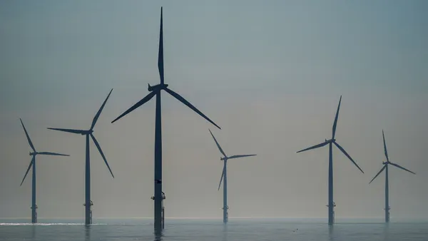The sun rises over the EDF energy offshore windfarm on July 19, 2024 in Redcar, England.