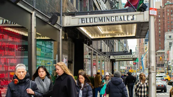 People walking down a city street.