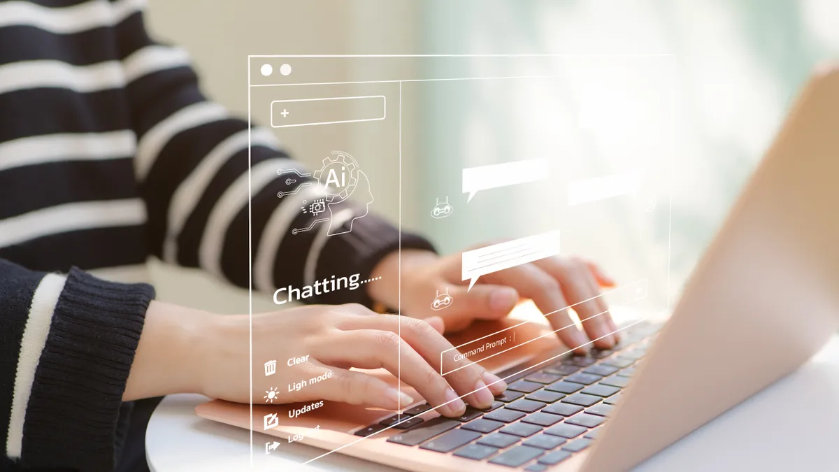 A student types on a computer while using a generative AI chat.