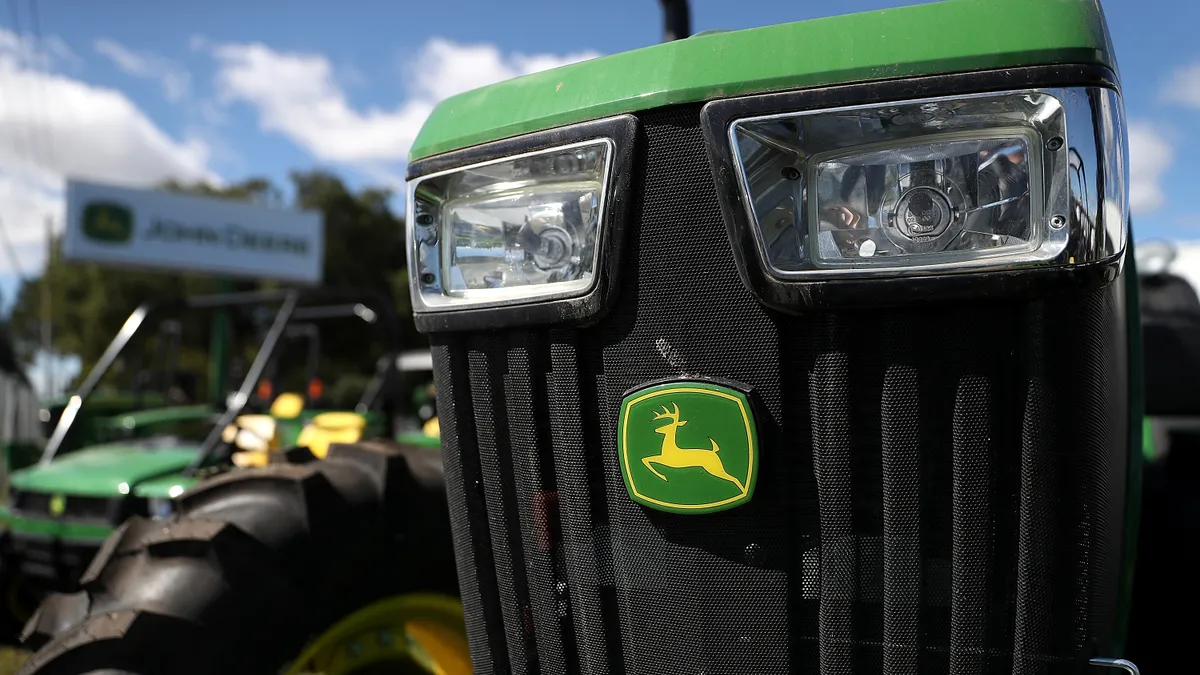 A Deere tractor in the foreground.