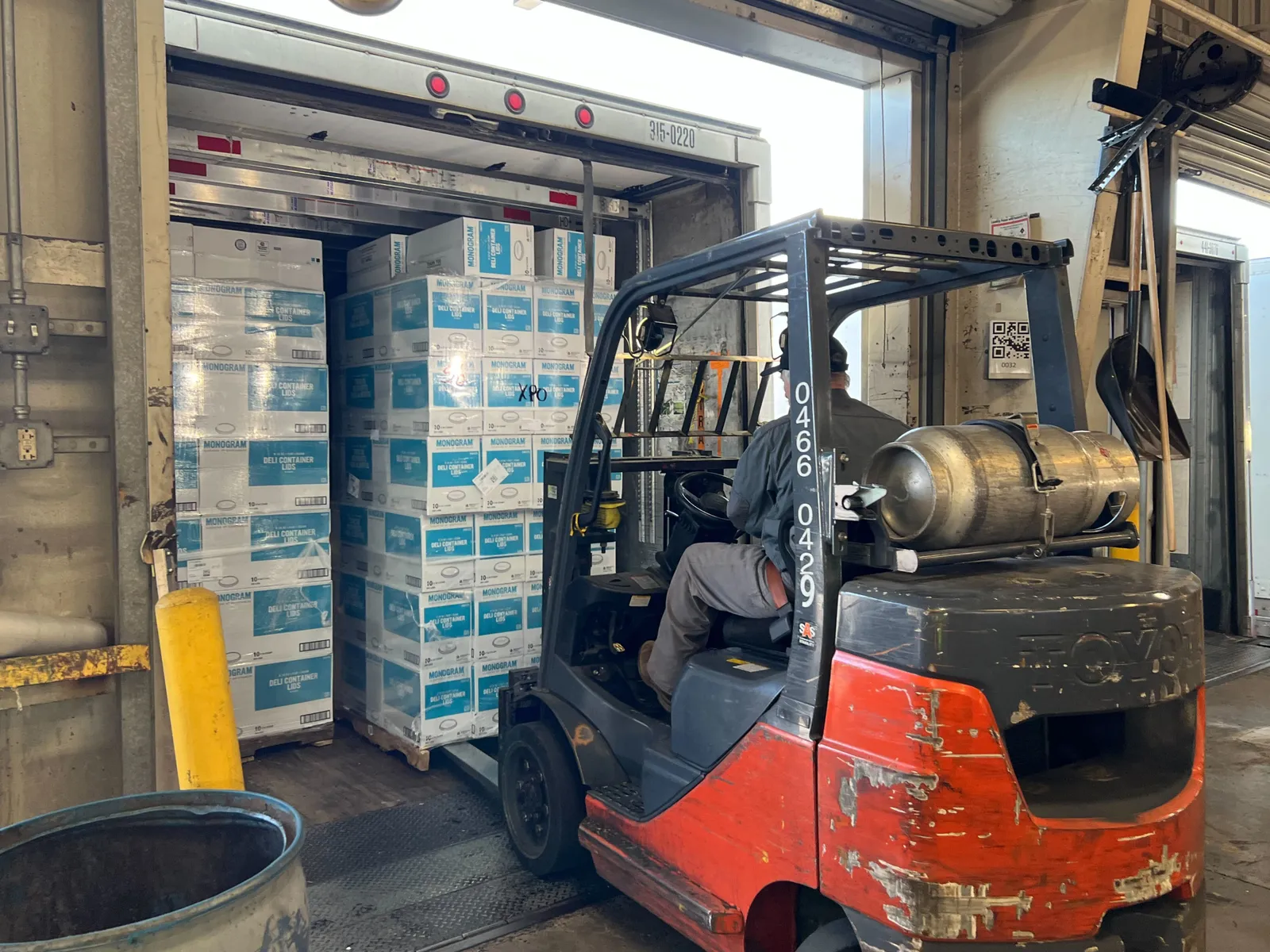 A forklift operator at the XPO Hagerstown terminal loads pallets of deli lids into a waiting trailer on Jan. 5, 2023.