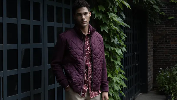 A person wearing Ted by Ted Baker.