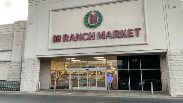 Exterior of grocery store with sign reading "99 Ranch Market" above the doors.