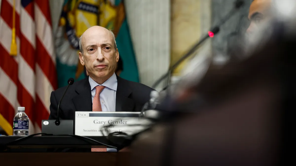 Securities and Exchange Commission (SEC) Chair Gary Gensler listens during a meeting.