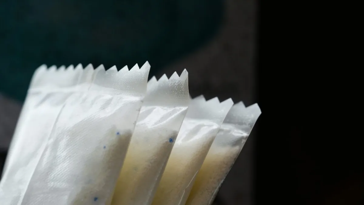 Close-up view of Notpla's dishwasher pods made from seaweed-based material.