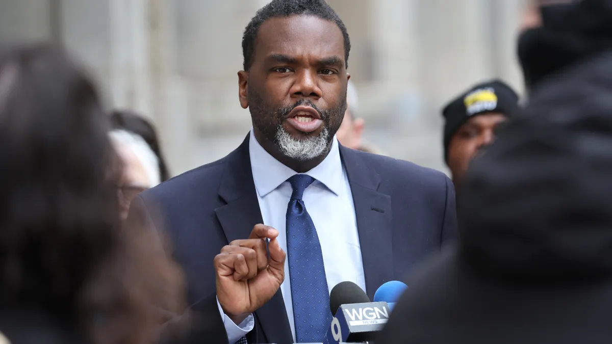 A person speaks at a podium