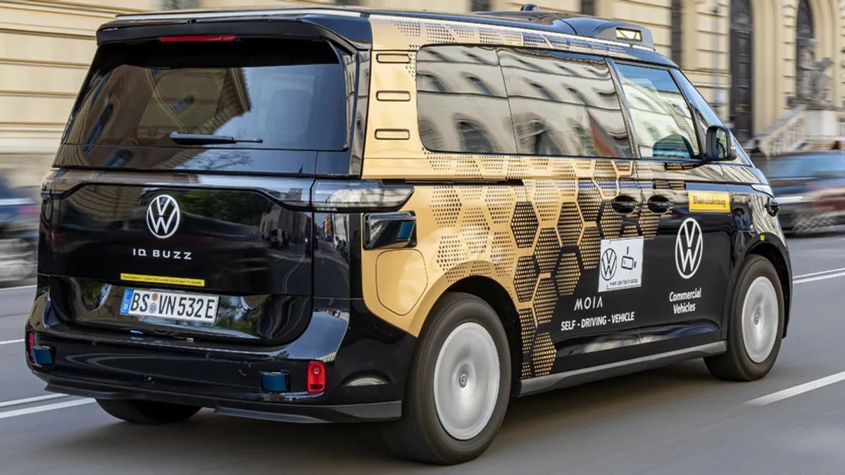 A black Volkswagen ID Buzz electric van outfitted with autonomous driving technology from Mobileye.