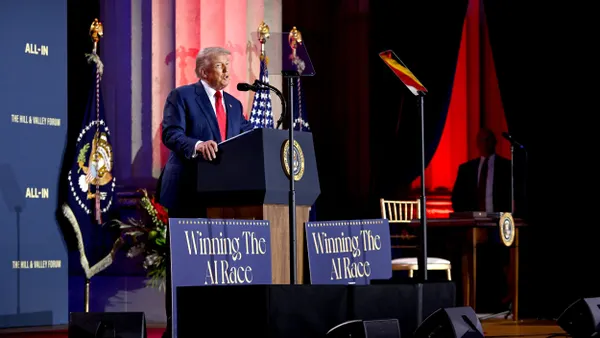 President Donald Trump speaks onstage.