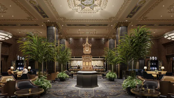 The lobby of the hotel features a golden clock.