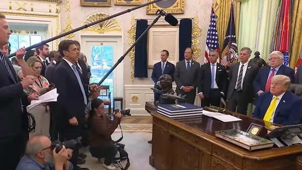 President Trump answers questions about funding and projects to support coal power at an event at the White House.