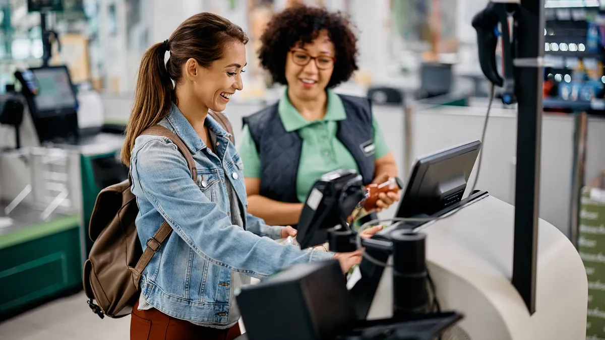 People at grocery store self checkout