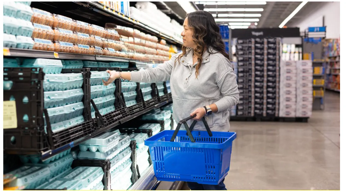 Women shopping eggs in supermarket