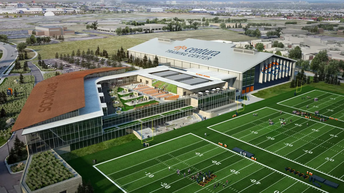 A rendering with an overhead view of the Denver Broncos' new HQ and three football fields in front of the building, which is modern and covered in large, glassy windows.