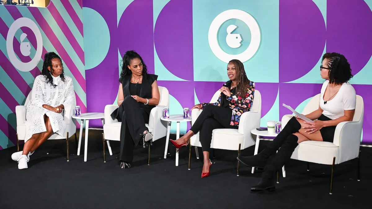 Several panelists discuss brand values on stage during a session at Advertising Week NY.