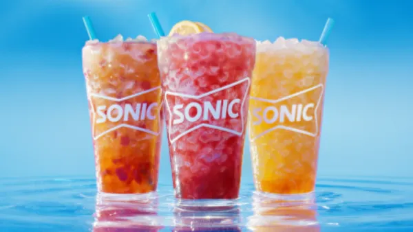 Three brightly colored drinks from Sonic.