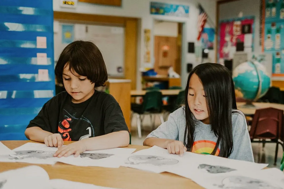 Students are sitting at desks in a classroom