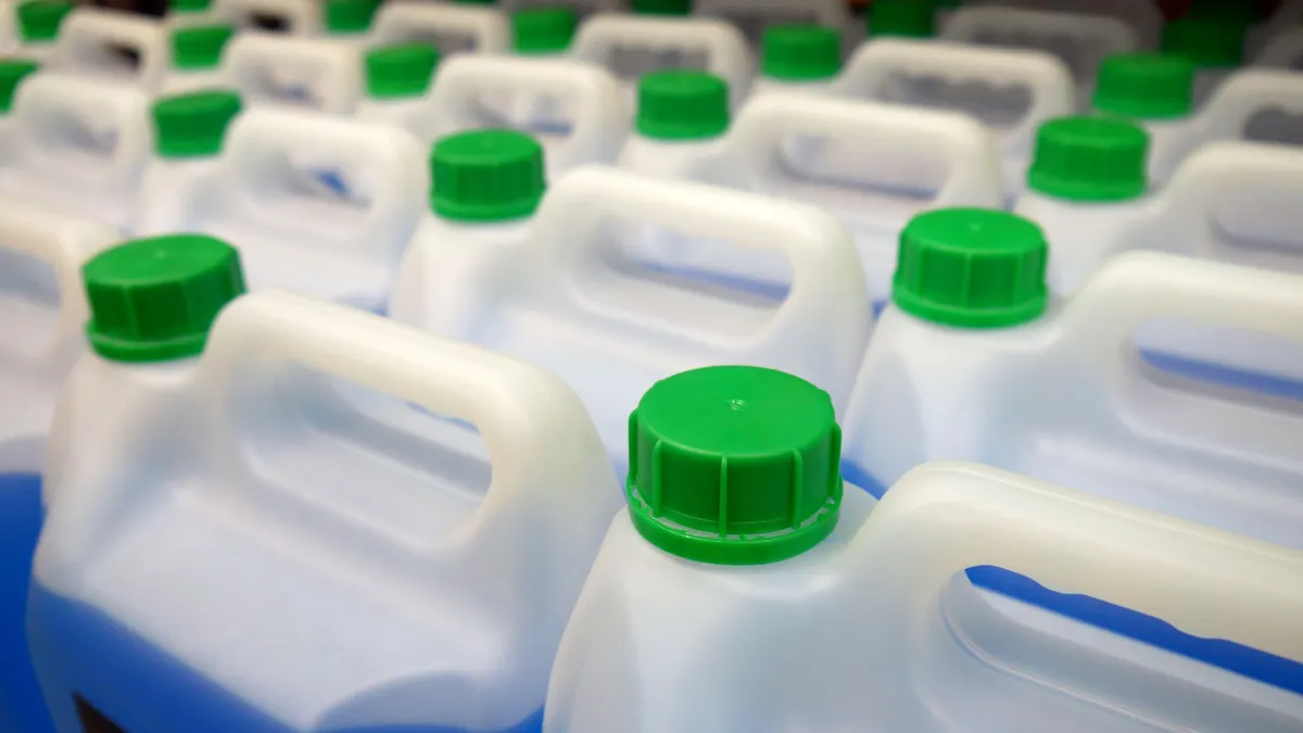 Plastic jerrycans containing antifreeze.