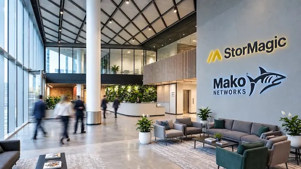 A lobby in an office building with the logos for StorMagica nd Mako Networks visible on the lobby wall.