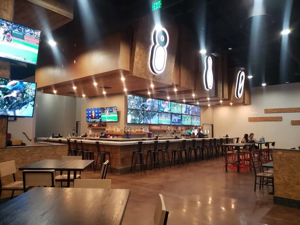 An image of tables and chairs and decorations with bowling pins.