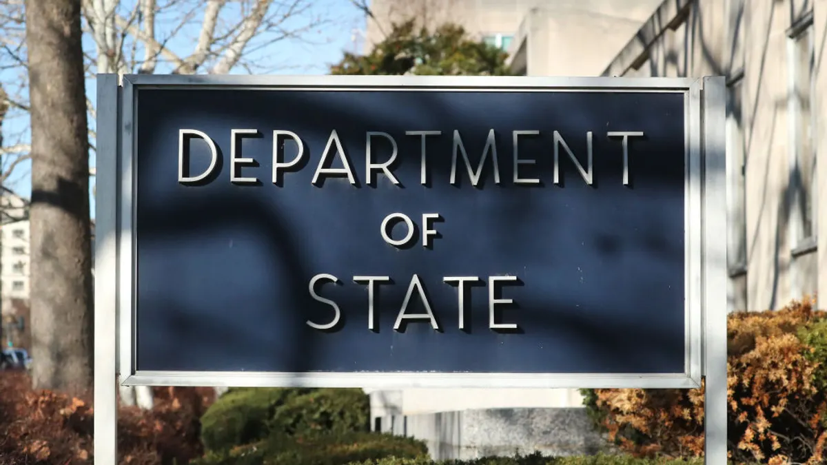 Department of State sign outside office building.
