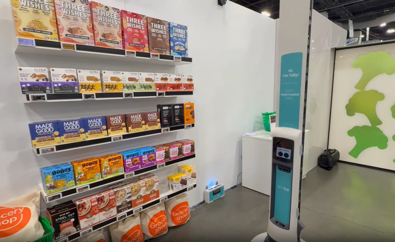 A grocery robot on a conference floor.