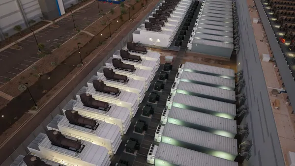 Equipment sits on a large rooftop.