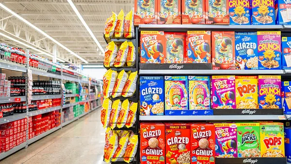 Boxes of various Kellogg's cereals are displayed on shelves