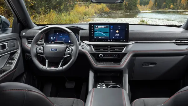 The interior of a 2025 Ford Explorer SUV showing the steering wheel and instrument panel.