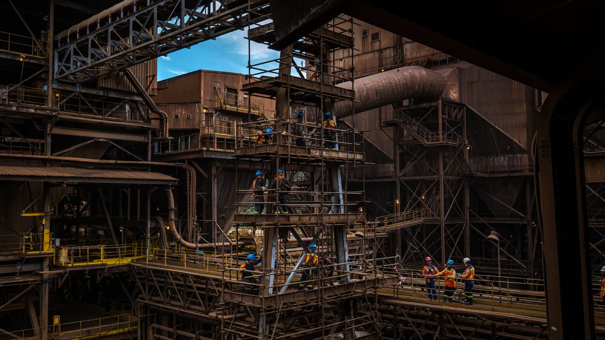 Workers seen at a nickel processing plant.