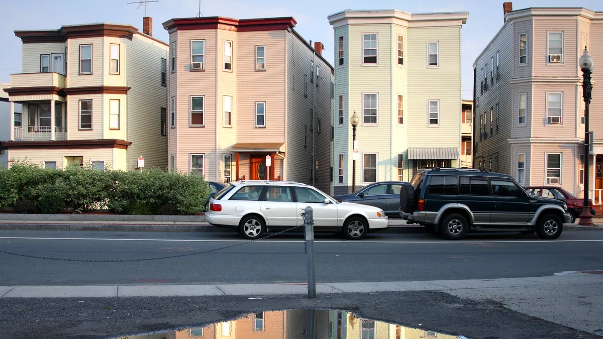 Street view of several three-story housing buildings