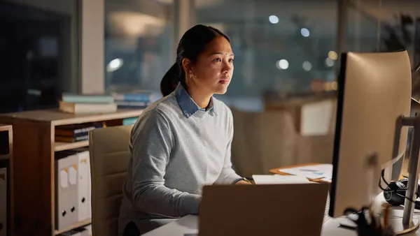 businesswoman, laptop and office at night for working