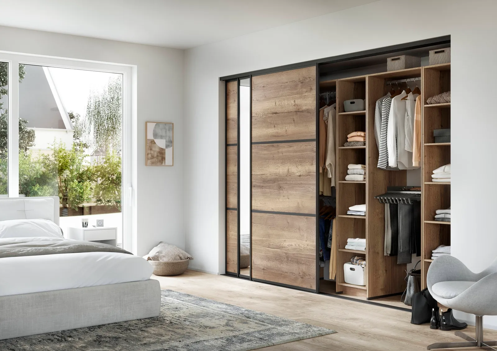 A bedroom with a closet with sliding doors.