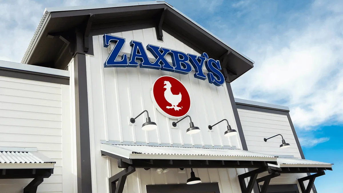 An image of a white building with blue logo that says Zaxbys