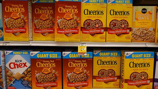 Boxes of Cheerios displayed on a store shel
